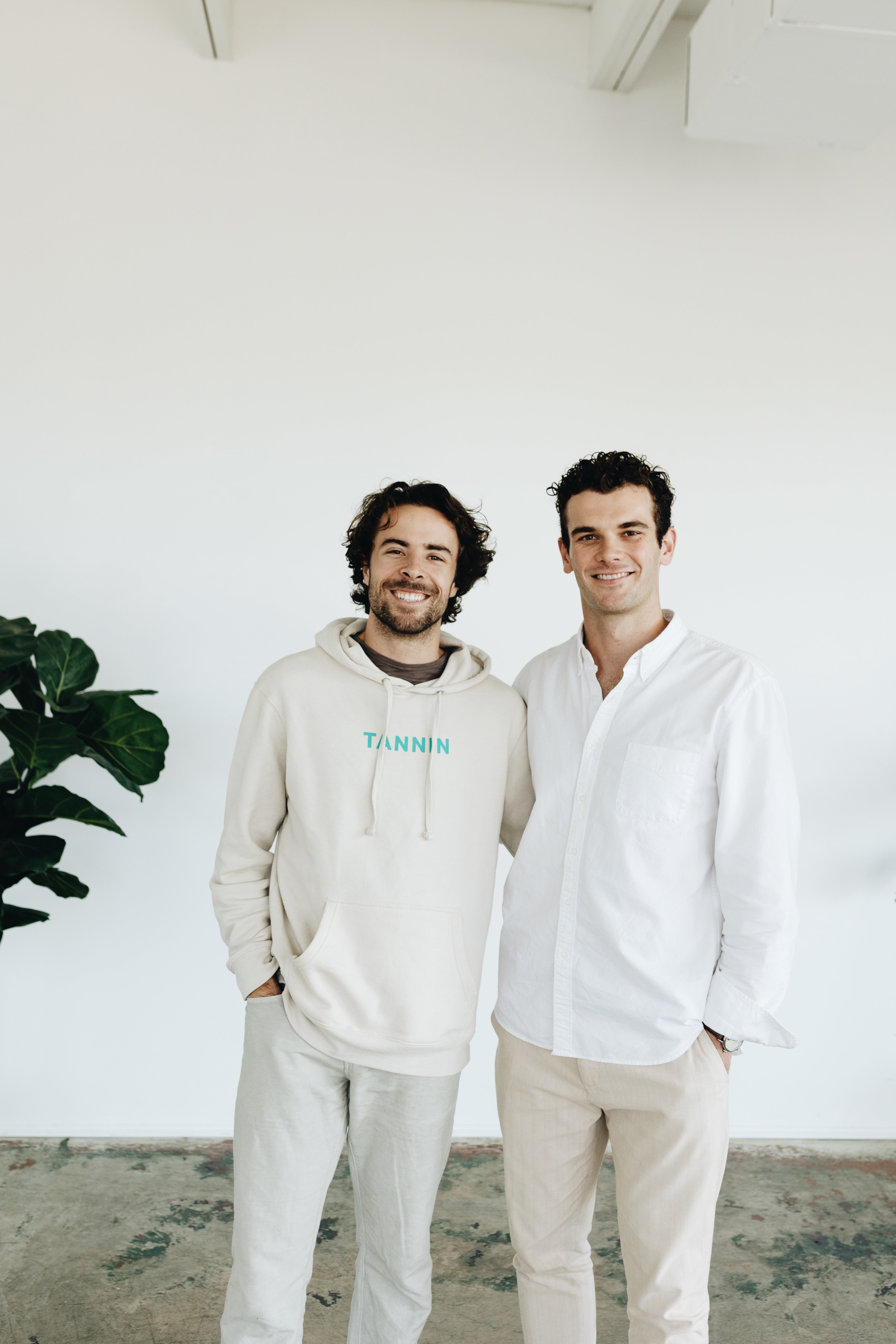 TANNIN Oral Care co-founders smiling in a bright, minimalist space — showcasing the brand’s approachable and modern identity.
